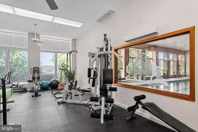 exercise room with ceiling fan