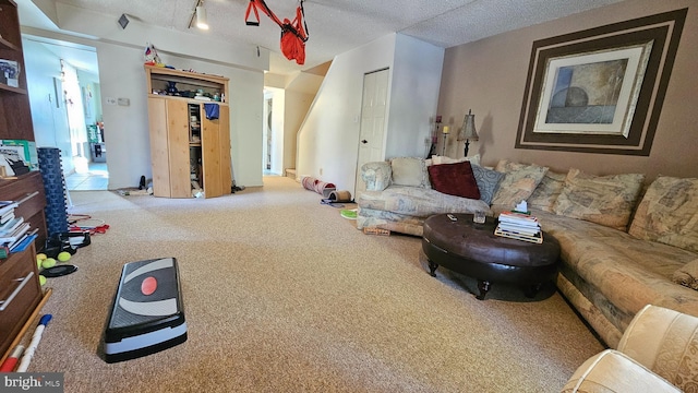 living room with track lighting and a textured ceiling