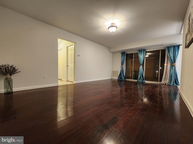 spare room with hardwood / wood-style floors