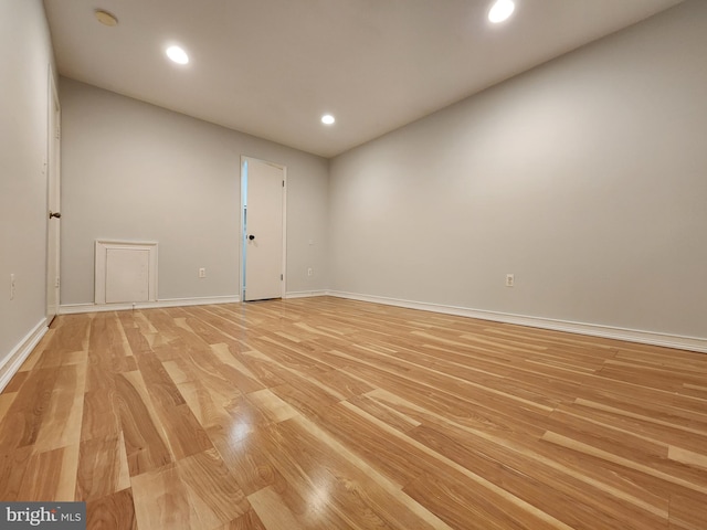 unfurnished room with light wood-type flooring