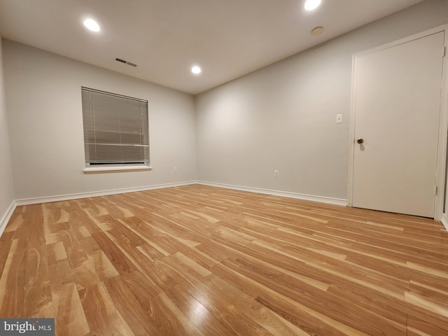 unfurnished room featuring light hardwood / wood-style floors