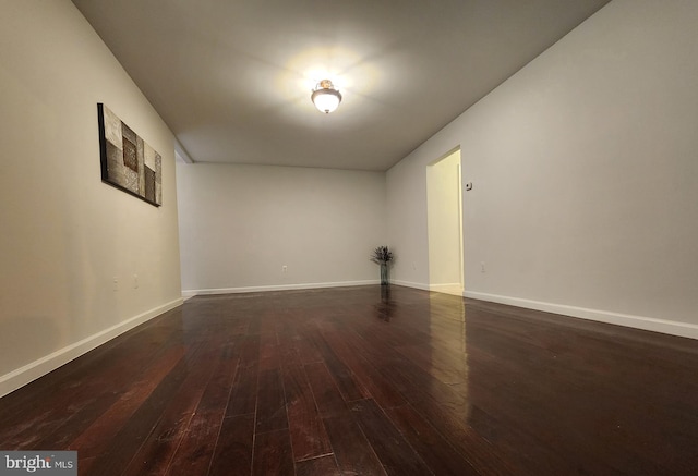 spare room featuring dark hardwood / wood-style floors