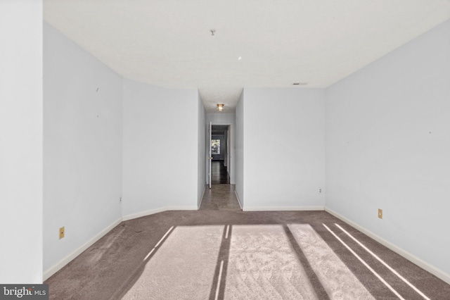 empty room featuring carpet flooring