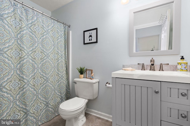 bathroom with toilet and vanity