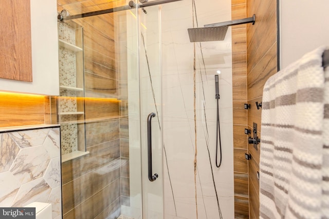 bathroom with a shower with shower door