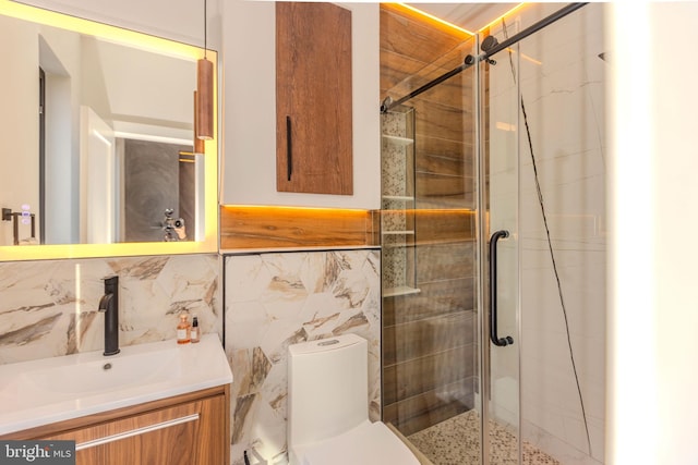 bathroom with vanity, tile walls, an enclosed shower, and toilet