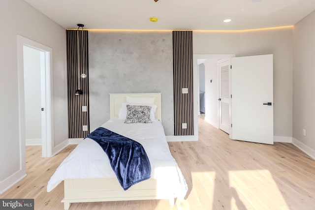 bedroom with light wood-type flooring