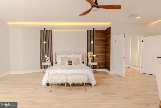 bedroom featuring light hardwood / wood-style floors and ceiling fan