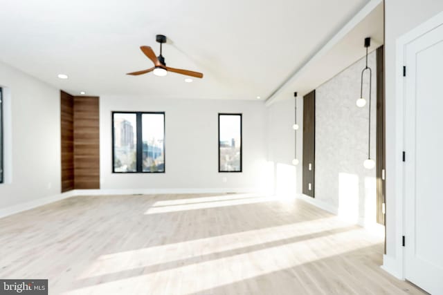 unfurnished room featuring ceiling fan and light hardwood / wood-style flooring