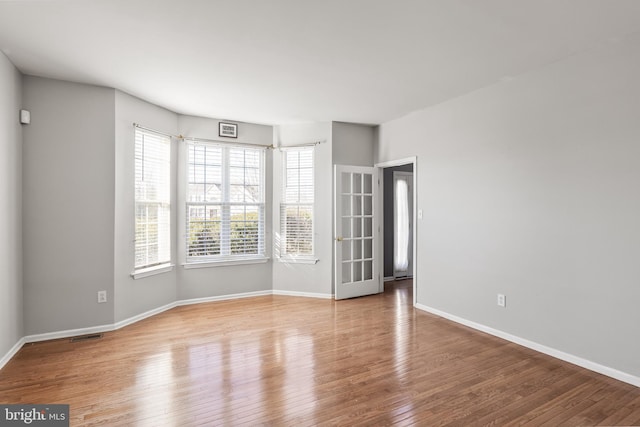 empty room featuring hardwood / wood-style floors