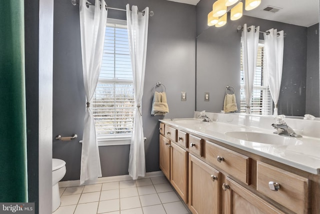 bathroom with vanity, tile patterned floors, and toilet