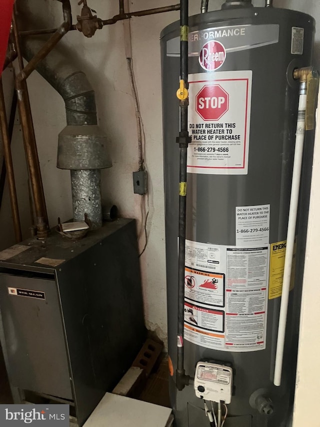 utility room with gas water heater