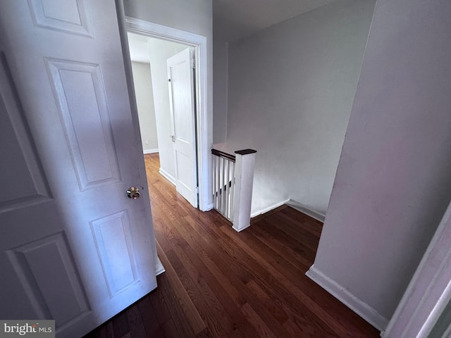 hall with dark hardwood / wood-style flooring