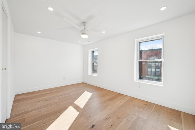 unfurnished room featuring ceiling fan and light hardwood / wood-style floors