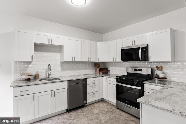 kitchen with sink, white cabinetry, and appliances with stainless steel finishes