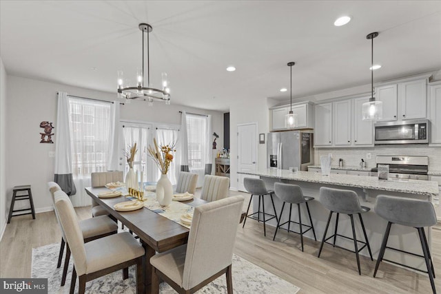 dining space featuring light hardwood / wood-style flooring