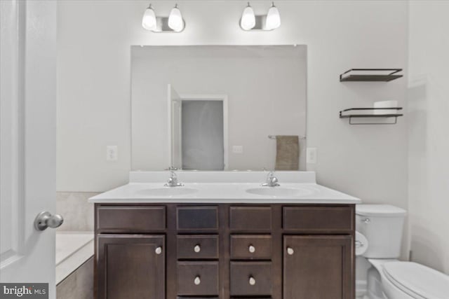 bathroom with vanity and toilet