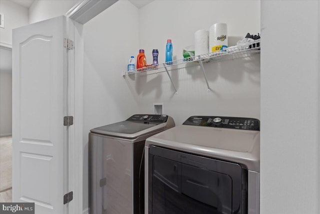 laundry room with washing machine and dryer