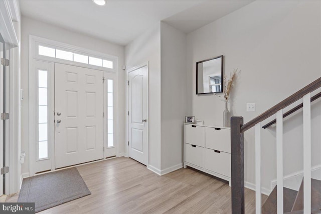 entrance foyer with light hardwood / wood-style floors