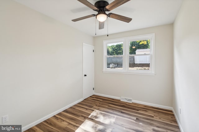 spare room featuring ceiling fan and wood-type flooring