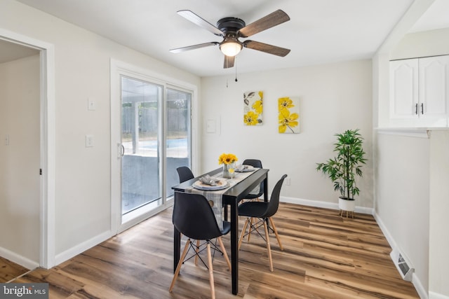 dining room featuring ceiling fan and hardwood / wood-style floors