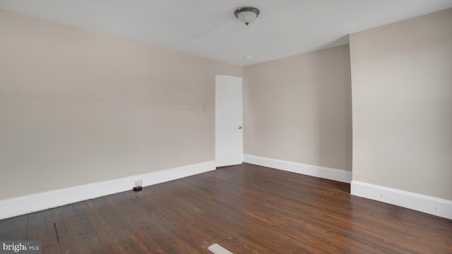 empty room featuring dark hardwood / wood-style floors