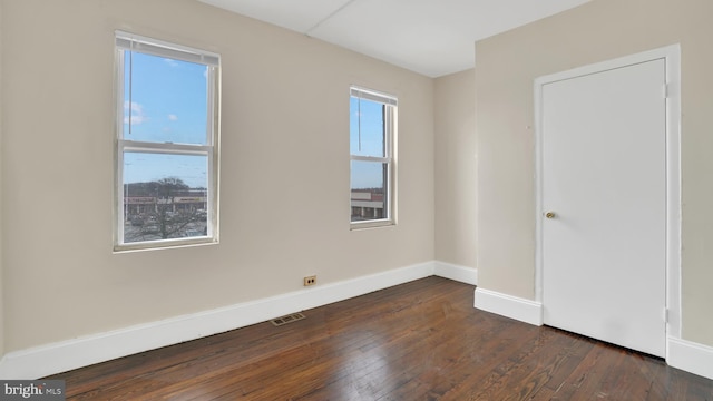 empty room featuring dark hardwood / wood-style floors