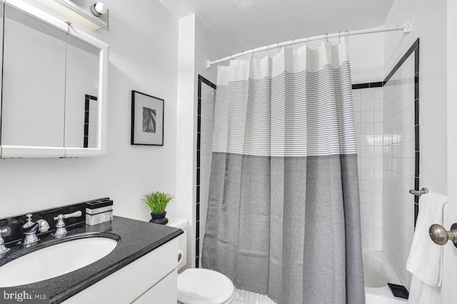 full bathroom featuring toilet, shower / bath combination with curtain, and vanity