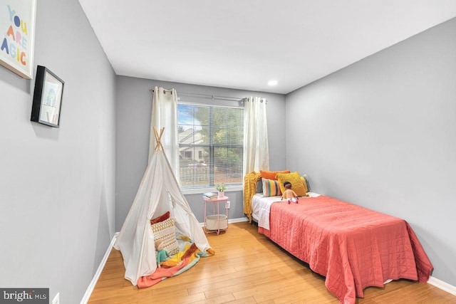 bedroom with light wood-type flooring