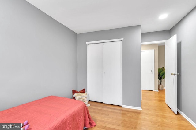 bedroom featuring a closet and light hardwood / wood-style floors