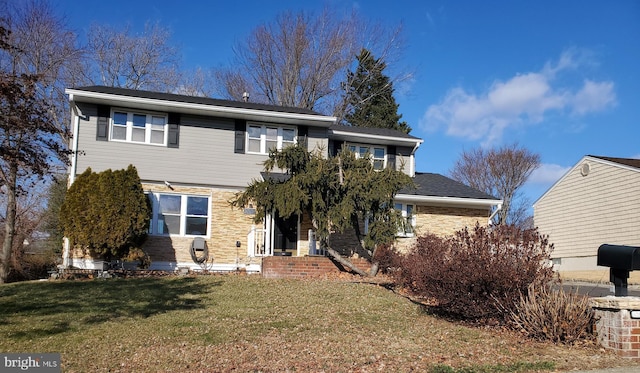 view of front of property with a front lawn