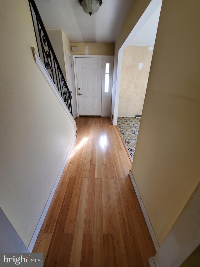 doorway with wood-type flooring