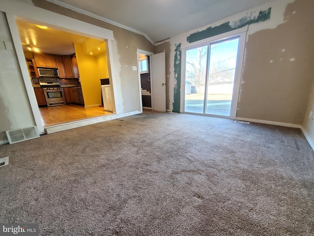 unfurnished living room with crown molding, light carpet, and lofted ceiling