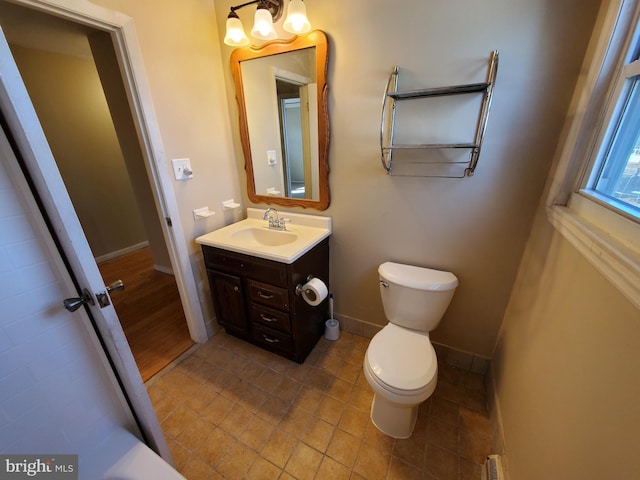 bathroom with toilet and vanity