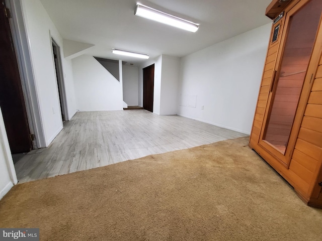 unfurnished room with light carpet