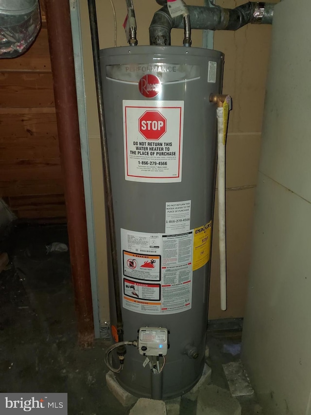 utility room featuring gas water heater