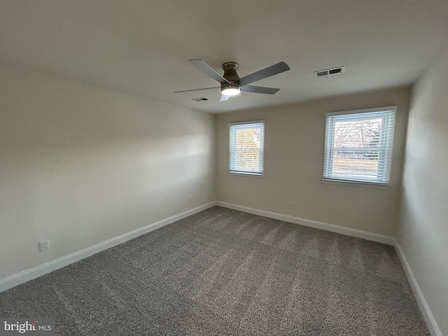 carpeted empty room featuring ceiling fan