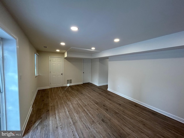 basement featuring dark hardwood / wood-style floors