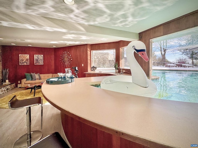 kitchen featuring wooden walls