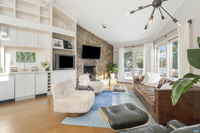 living room featuring high vaulted ceiling, light wood-type flooring, a fireplace, and wood ceiling