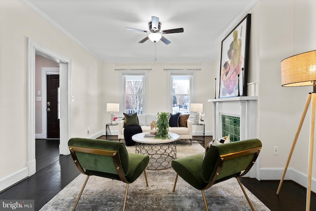 sitting room featuring ceiling fan, dark hardwood / wood-style flooring, and crown molding