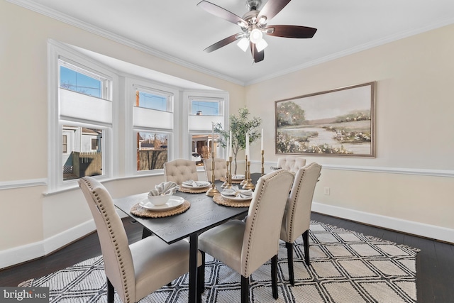 dining room with ornamental molding, ceiling fan, and dark hardwood / wood-style floors