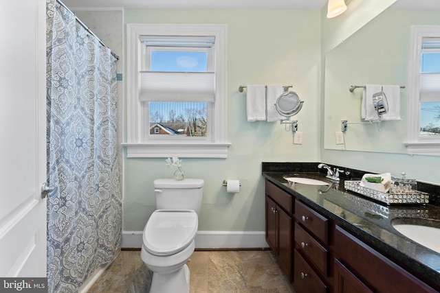 bathroom with toilet and vanity