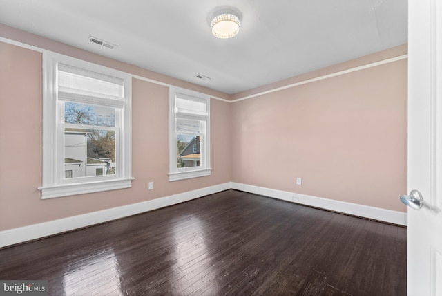 unfurnished room featuring dark hardwood / wood-style flooring