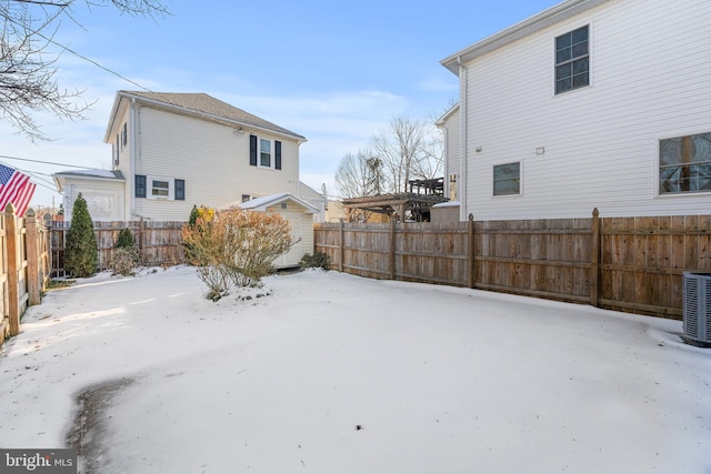 yard layered in snow with cooling unit