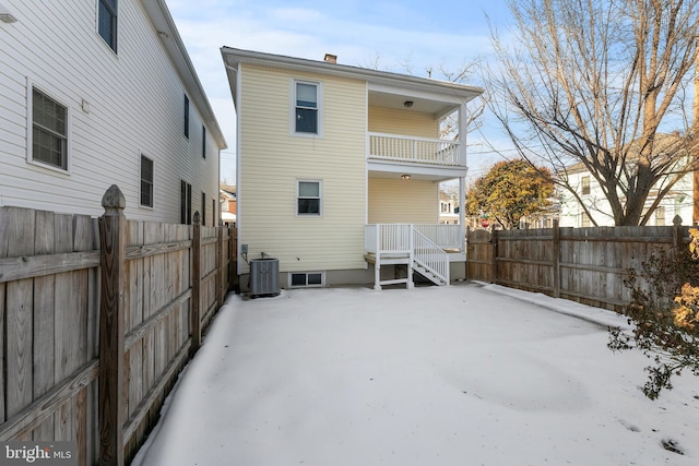 back of property featuring central AC and a balcony