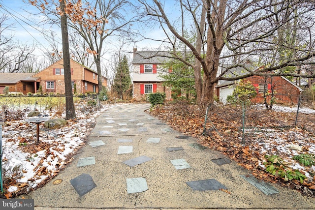 exterior space with brick siding