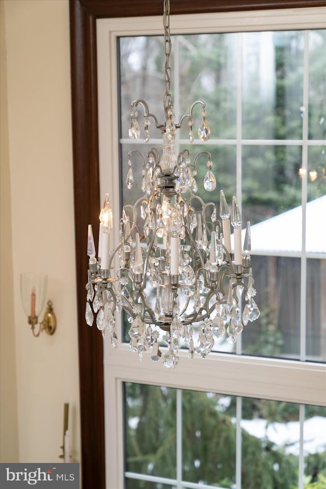 interior details featuring a chandelier