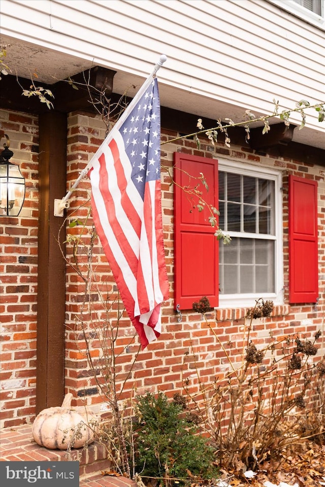 property entrance with brick siding