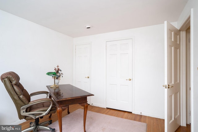 office area with light wood-style floors